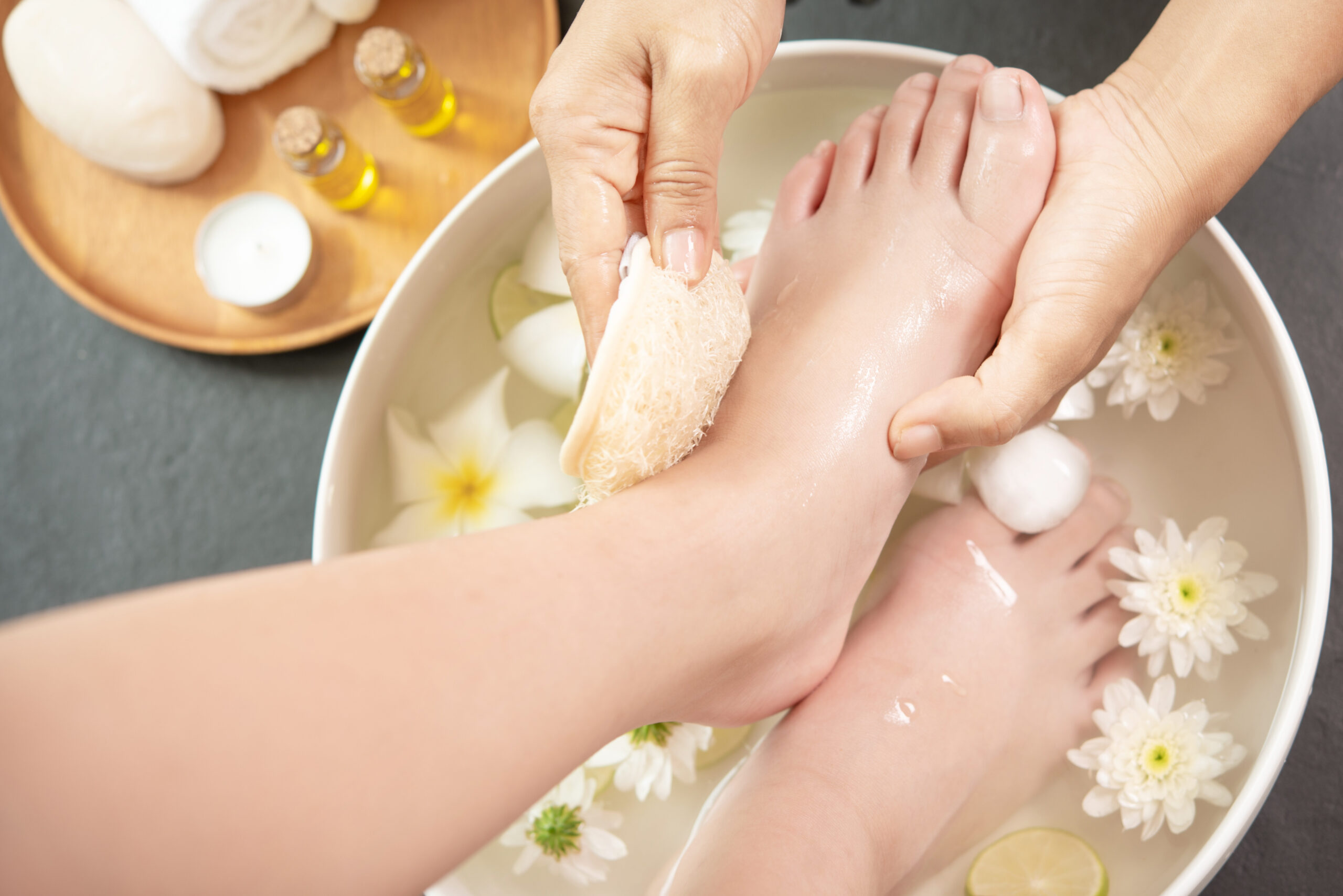 foot washing in spa before treatment. spa treatment and product